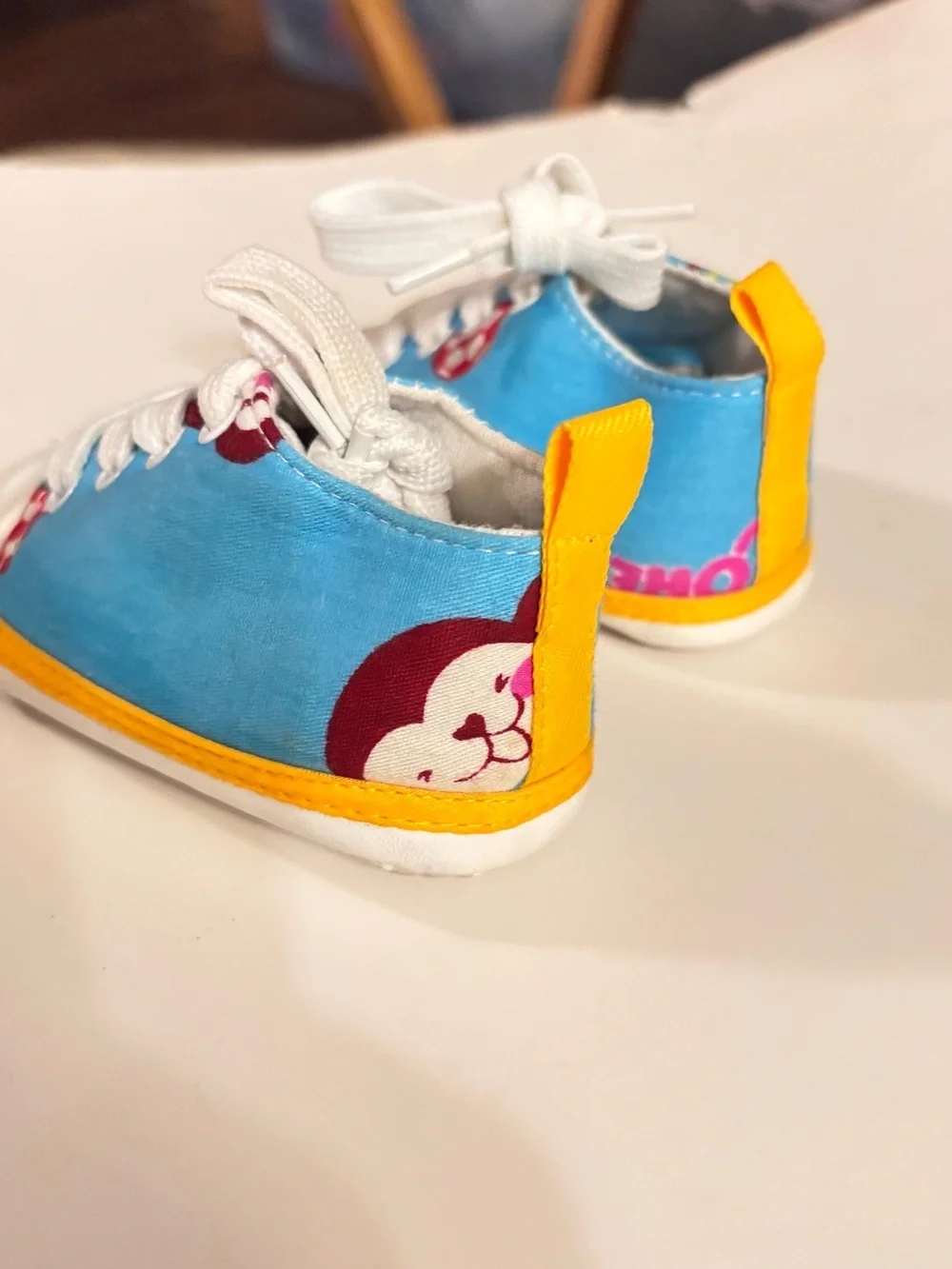 Blue baby sneakers with cartoon character graphic #babyshoes #cartoon